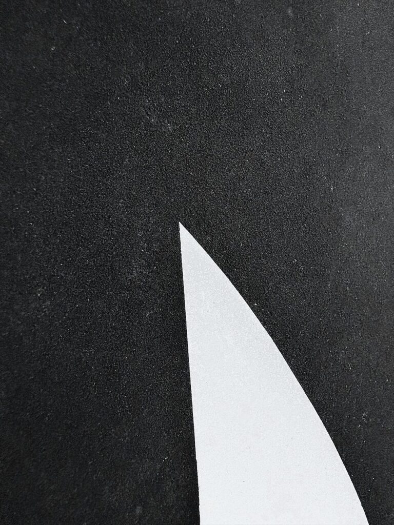 Extreme close-up of Formal Gathering, No. 1 surface, highlighting the textured powdered charcoal application, subtle paper grain, white cut-ins of unmarked paper, and faint graphite grid remnants from earlier planning.