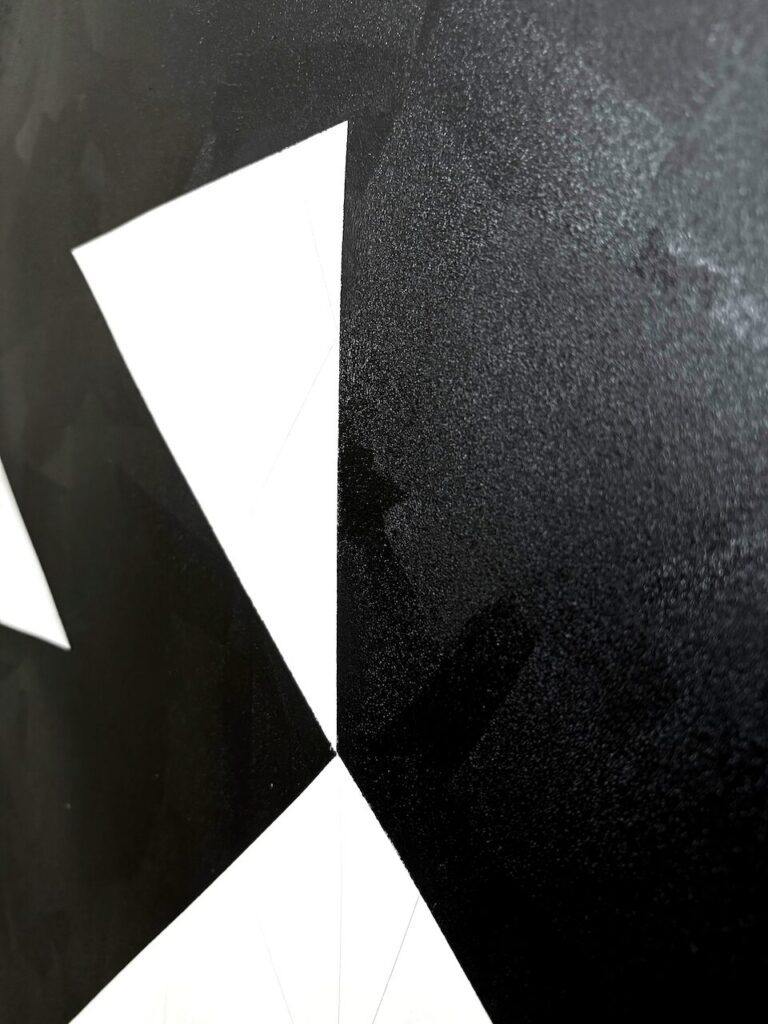 Extreme close-up of Open House surface, showing uniform oil stick application, subtle variations in texture from brayer pressure, white cut-ins of unmarked paper, and faint remnants of graphite grid lines from earlier compositional planning.